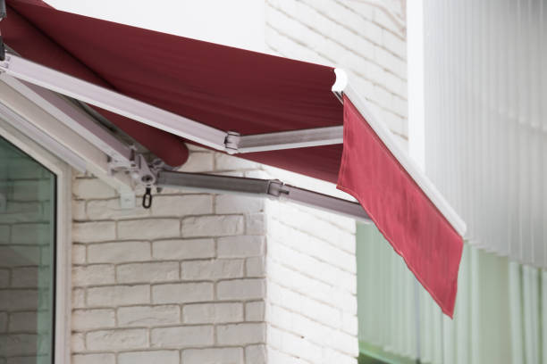 Jasa Kanopi Kain red awning over window of shop.